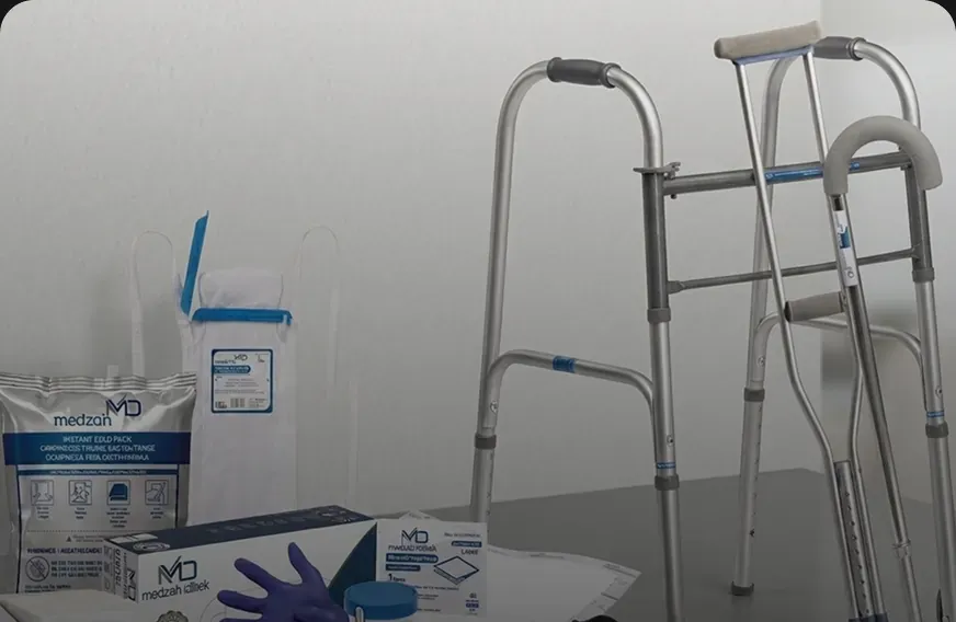 Medzah packaging and medical products staged together, boxes, gloves and a walking frame